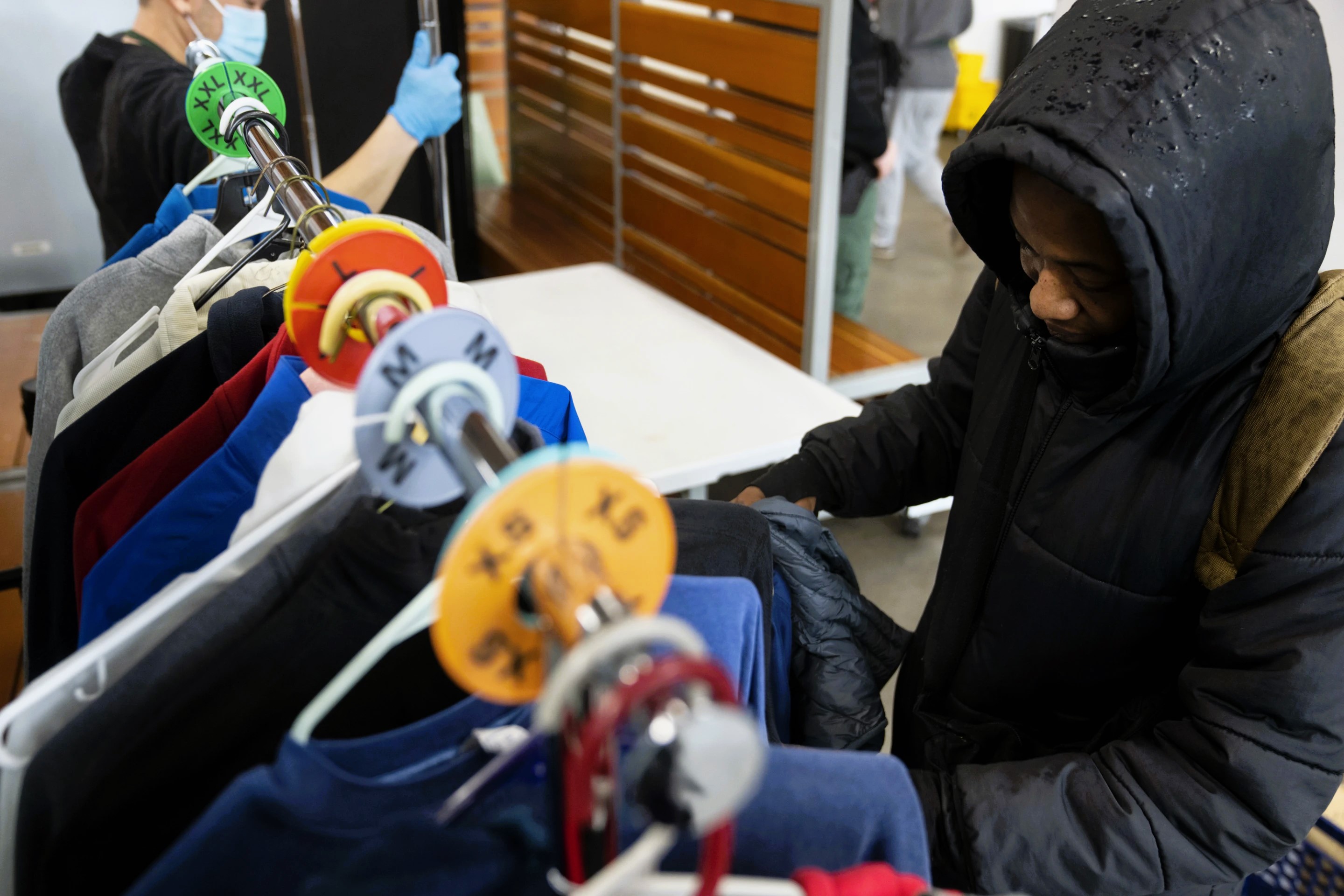 photo: people searching for warm clothes